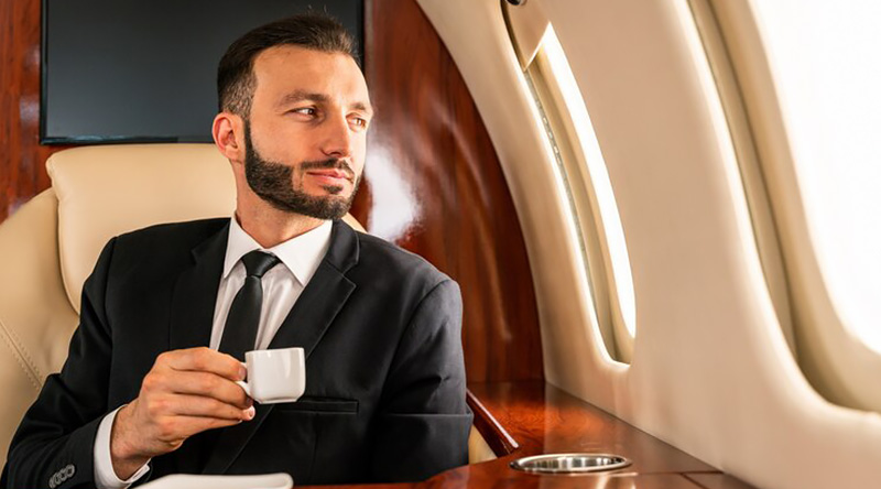 businessman-drinking-tea-in-a-private-plane